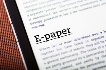 Obraz premium E-paper on tablet screen, ebook concept
