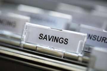 Savings heading in filing cabinet