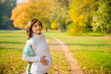 Pregnancy - happy woman in nature