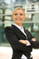 Happy businesswoman smiling in the city