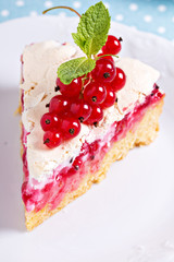 A piece of meringue red currant cake