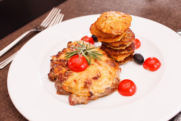 meat with potato pancakes