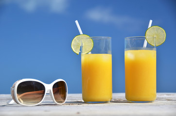 Sunglasses and orange juice