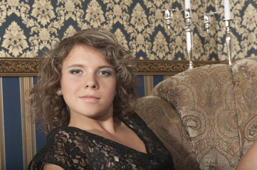 Fototapeta premium Curly girl in black dress
