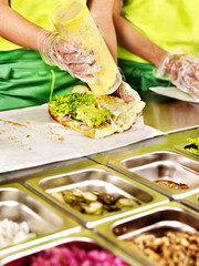 Tray with  food  on showcase at cafeteria