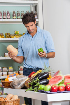 Man Shopping Vegetables In Supermarket