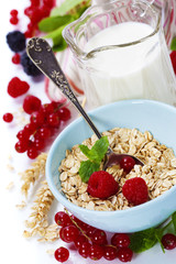 healthy breakfast with bowl of oat flakes