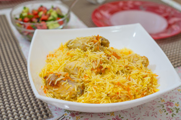 rice with chicken on a dining table