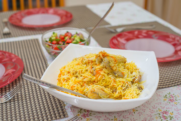 rice with chicken on a dining table