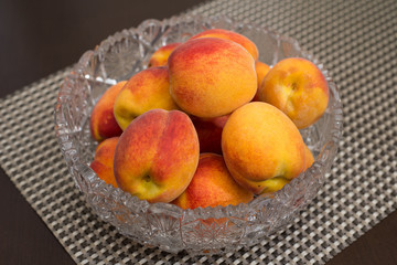 Fresh peaches in a vase