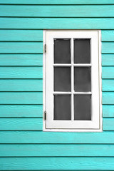 white wood window and blue wall