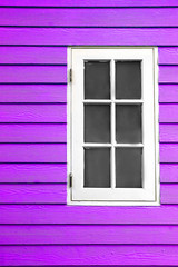 white wood window and purple wall