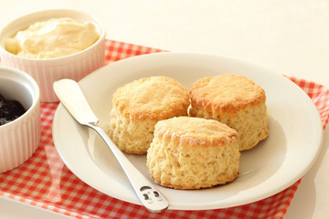 Home-baked scones with clotted ceam and blackcurrant jam