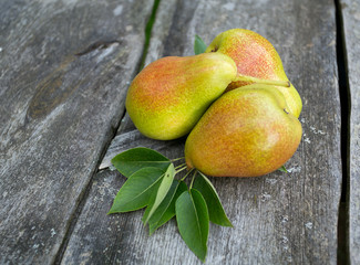fresh pears on wooden surface