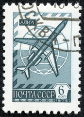 stamp printed in the USSR shows old plane TU - 154
