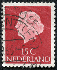 stamp printed in Netherlands, shows portrait of Queen Juliana