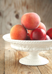 Fresh peaches in vase