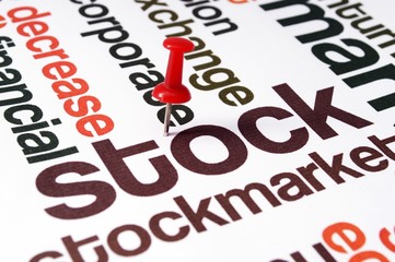Fototapeta premium Push pin on stockmarket text