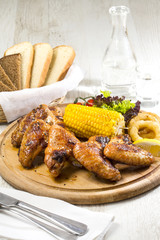 chicken wings are grilled
