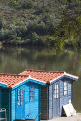 View of two small fisherman cabins on the docks.