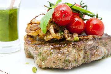 roasted rabbit meat and potatoes with vegetables