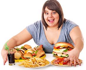 Woman eating fast food.