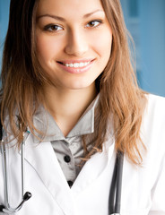 Cheerful female doctor at office
