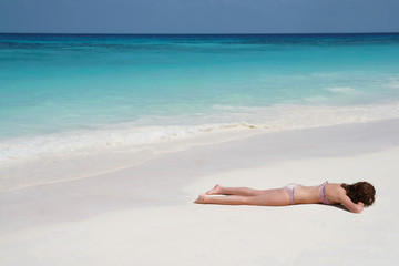 Fototapeta na wymiar women sunbathing on beach