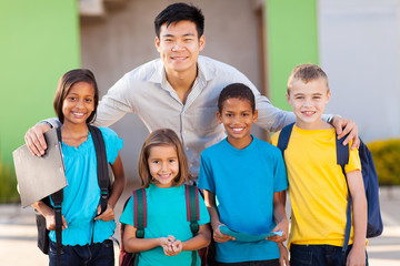 elementary school students and teacher outdoors