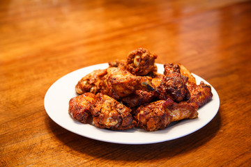 Mesquite Wings on White Plate and Wood Table