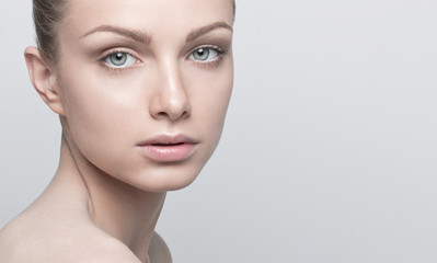 Fototapeta premium Portrait of beautiful young woman with clean and healthy face. N