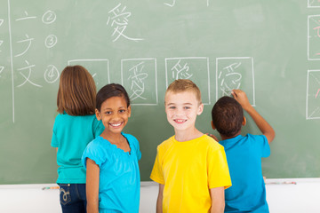 elementary school students after writing on chalkboard
