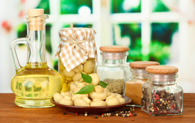 Composition of delicious marinated mushrooms, oil and spices