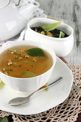 Cup of tea with linden on napkins on    wooden table