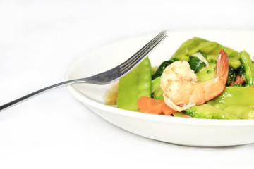 Stir-fried vegetables with fork