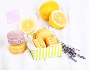 Macaroons on white cloth close-up