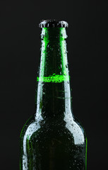Bottle of beer on black background