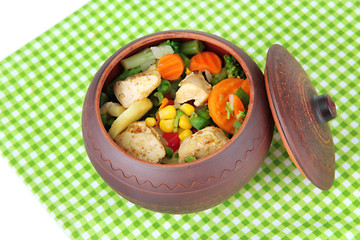 Baked mixed vegetable with chicken breast in pot, isolated
