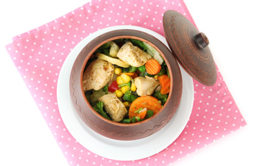 Baked mixed vegetable with chicken breast in pot, isolated