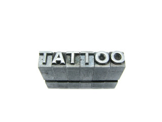 Tattoo sign, antique metal letter type isolated