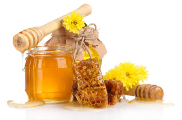two jars of honey, honeycombs and wooden drizzler isolated