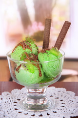 Delicious ice cream on table in room