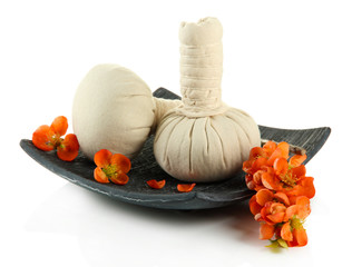Herbal compress balls for spa treatment and flowers isolated