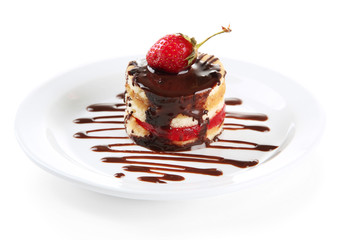 Tasty biscuit cake with chocolate and berry