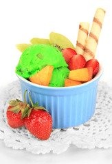Delicious  ice cream with fruits and berries in bowl isolated
