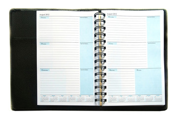 notebook and pen on white background