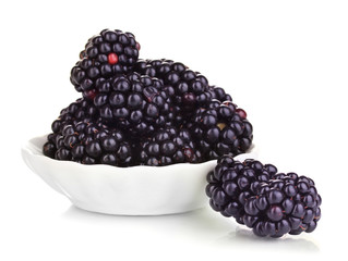 Sweet blackberry in bowl isolated on white