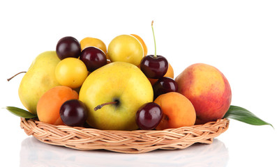 Bright summer fruits in basket isolated on white