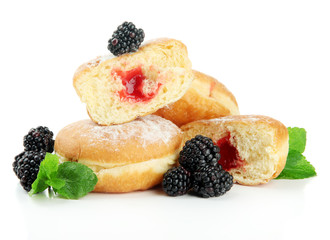 Tasty donuts with berries, isolated on white