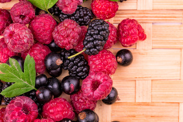 Fresh berries on a wicker backgound